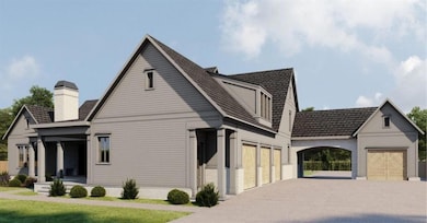 View of side of property with a yard and a garage