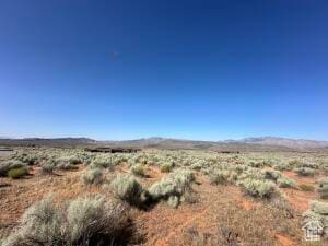 View of mountain backdrop featuring a desert landscape