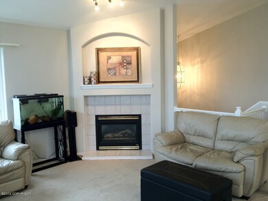Sunny Living Room w Gas Fireplace