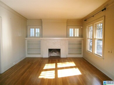 handsome fireplace and original hardwood floors