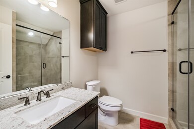 The first-floor en suite bath feels brand new—feat