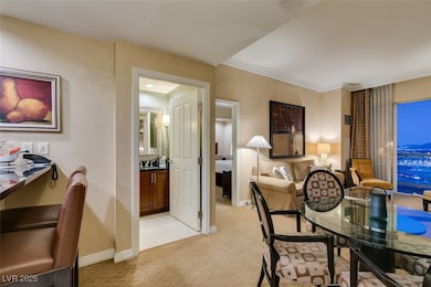 Dining space with ornamental molding and baseboard