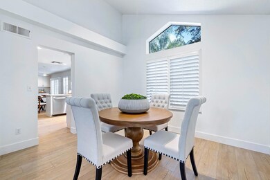 Formal dining room looking towards kitchen.