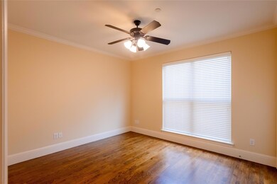 Empty room featuring crown molding, ceiling fan, a