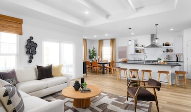 Great room with coffered ceiling and white painted ceiling beams