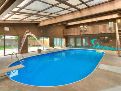 View of swimming pool featuring a patio, a diving 