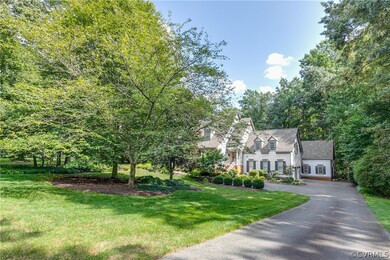 Paved drive leads to the house