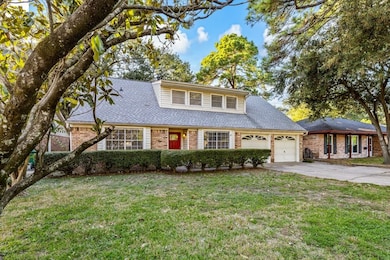 Street view of the home with a spacious front yard.