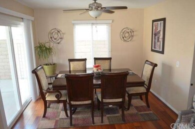 Formal dining area with slider leading to backyard