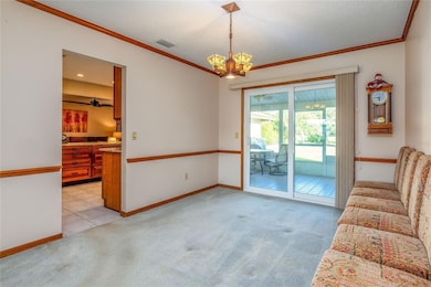 Formal dining room opens to back porch