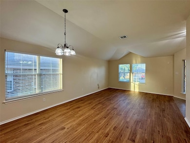 Unfurnished room with vaulted ceiling, wood finis
