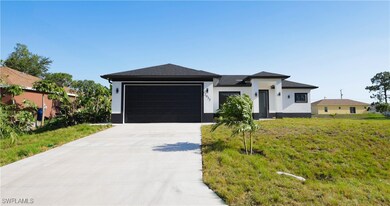 View of front of house with an attached garage, co