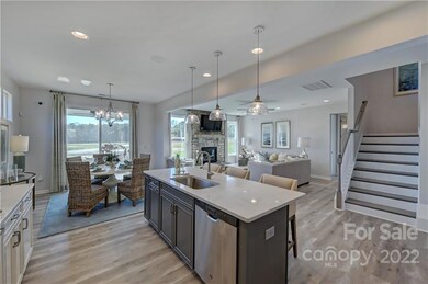 REPRESENTATIVE PHOTOS. The kitchen opens to casual dining and great room.