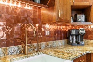 The copper backsplash adds a modern flair to the t
