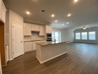 Kitchen with ceiling fan, stainless steel applian