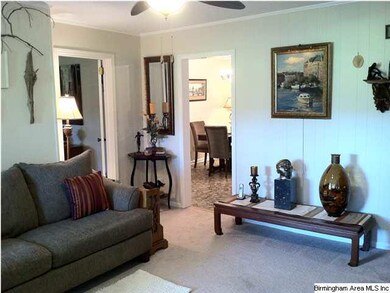 Living room with new carpet and paint with view to