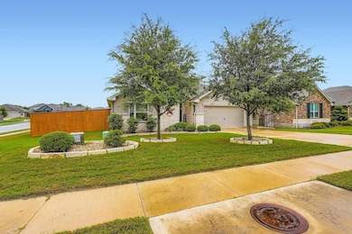 Obstructed view of property with concrete driveway, a garage, and stone siding