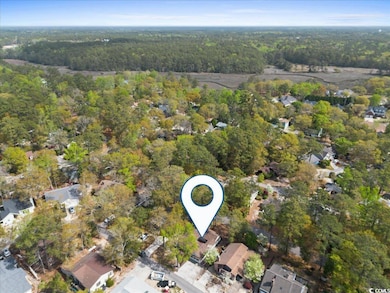 Aerial view with a residential view and a forest v