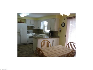 DINING AREA VIEW TO RENOVATED KITCHEN