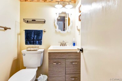 Bathroom featuring oversized vanity and toilet