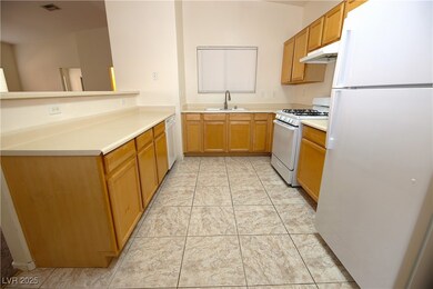 Kitchen with white appliances, under cabinet range