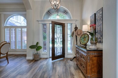 Entry way features leaded-glass and wrought iron d