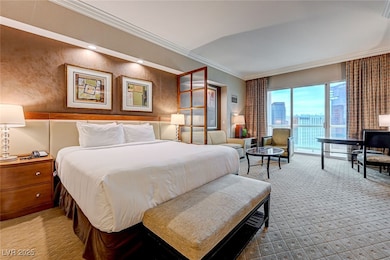Carpeted bedroom featuring crown molding and access to exterior