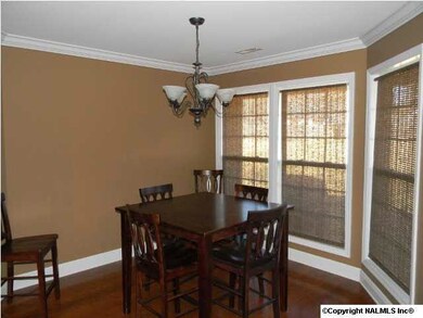 Dining features hardwood floors, crown molding , lots of windows for natural light and opens into the kitchen for a nice flow.