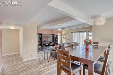 Looking to the entry & open flow from dining to li