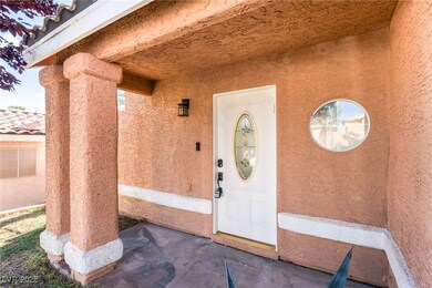 Property entrance featuring stucco siding and a porch