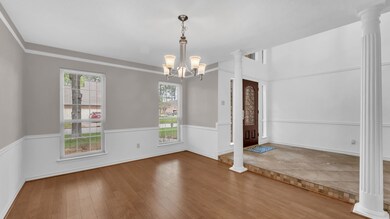 Formal dining room or flex space upon entry