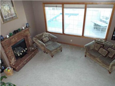 View from staircase overlooking living room. Windo