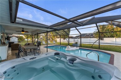 View of pool with a patio, glass enclosure, a shed