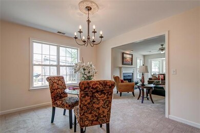 Dining room also has natural light.  Chandelier with medallion. 