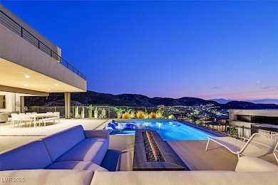 View of pool with a mountain view, a patio, an out