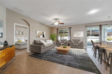 Virtually staged. KITCHEN overlooks LIVING ROOM wi