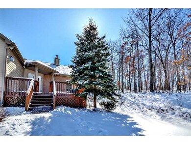 Exterior Front. Private setting with deck overlook
