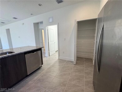Kitchen featuring stainless steel appliances, ligh