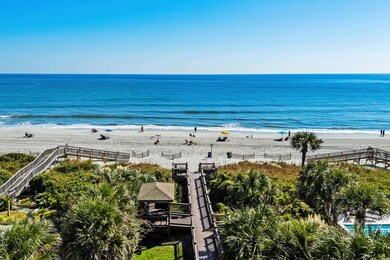 Property view of water with a beach view