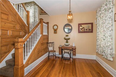 Large entry with gleaming original  wood work