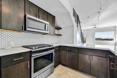 Kitchen featuring appliances with stainless steel