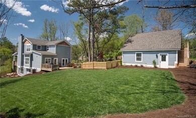 Rear of house, detached garage, fully fenced in ya