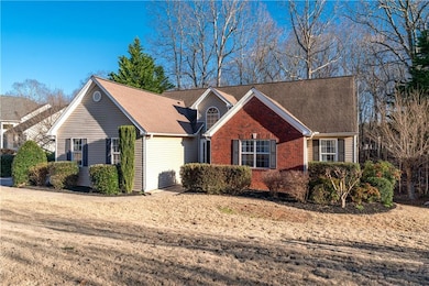 Ranch-style house featuring a shingled roof and br