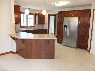Large kitchen with granite countertops, stainless 