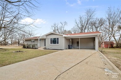 Nice long driveway with a 2 car carport, back clos