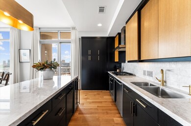 This kitchen features modern design with sleek bla