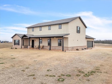 View of front of home featuring a garage