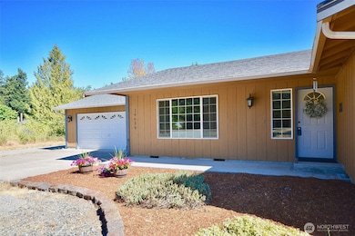 There's a large 528 sq ft garage attached with room for both parking and storage. Flower beds in front for anyone with a green thumb.