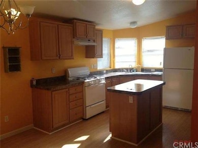 Kitchen has an island and full pantry.