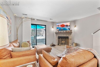 Living room featuring a fireplace and wood finished floors